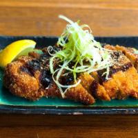 Chicken Katsu · Breaded fried chicken or pork cutlet. Topped with white scallions,
tonkatsu sauce, and groun...