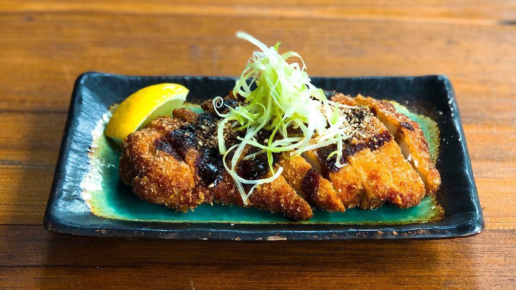 Chicken Katsu · Breaded fried chicken or pork cutlet. Topped with white scallions,
tonkatsu sauce, and ground sesame.