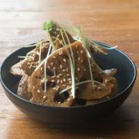 Kimpira · Lotus and burdock roots in sweet vinegar soy sauce, sprinkled with sesame seeds.