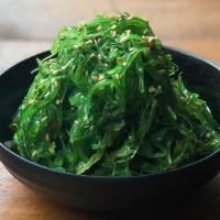 Kelp Salad · Light green marinated seaweed.