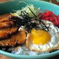 Chashu Don · Braised pork belly served over rice with fried egg, pickled ginger, scallions, sesame seeds,...