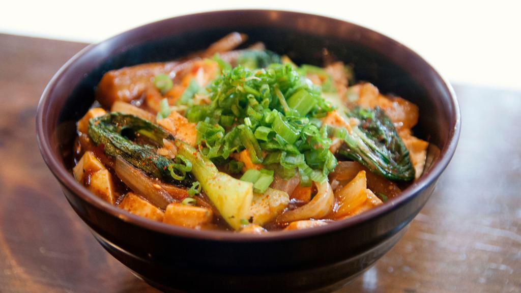 Mabo Tofu Don · Tofu, eggplant, sauteed bok choy, and onions, sprinkled with togarashi and topped with green scallions.