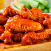 Buffalo Chicken Wings · Deep fried chicken wings tossed in a spicy buffalo sauce.