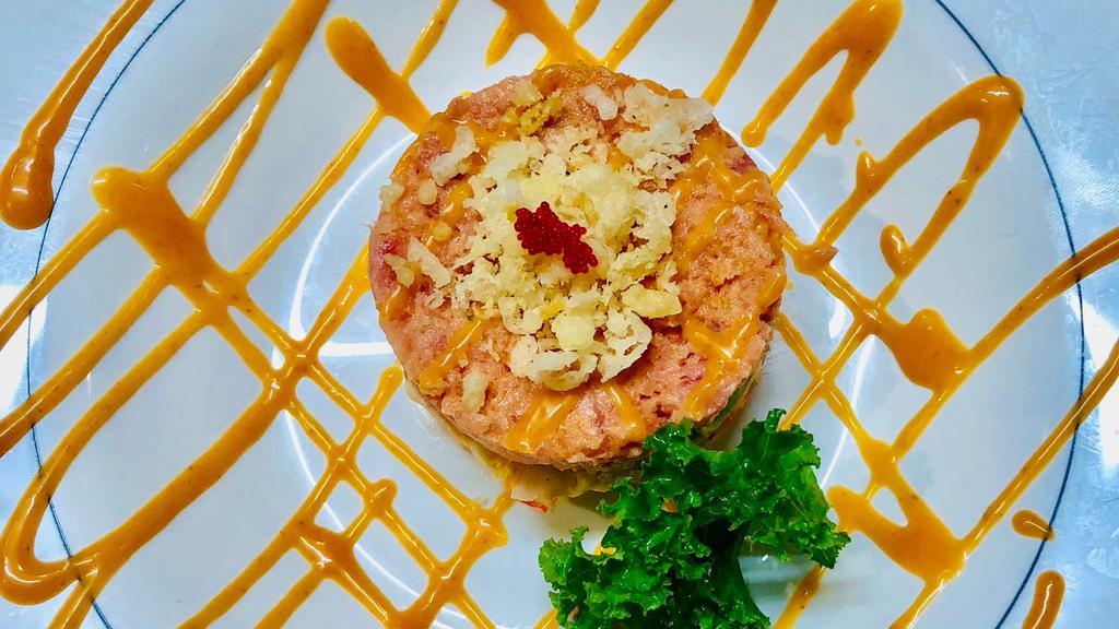 Spicy Tuna Tartar · Spicy tuna, spicy crab and avocado on a bed of mixed greens. Topped with spicy mayo and crunch.