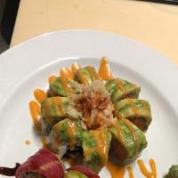 Volcano · Spicy tuna, cucumber roll topped with avocado, spicy crab and crunch. Spicy mayo.