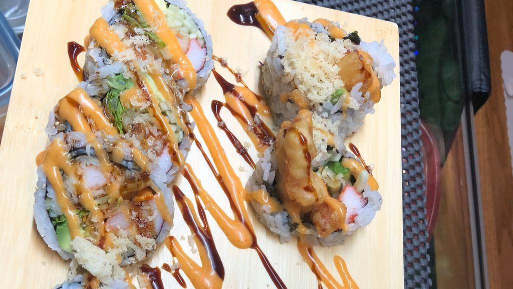 Manhattan · Shrimp tempura, crabmeat, avocado, cucumber, lettuce roll with crunch. Eel sauce, spicy mayo.