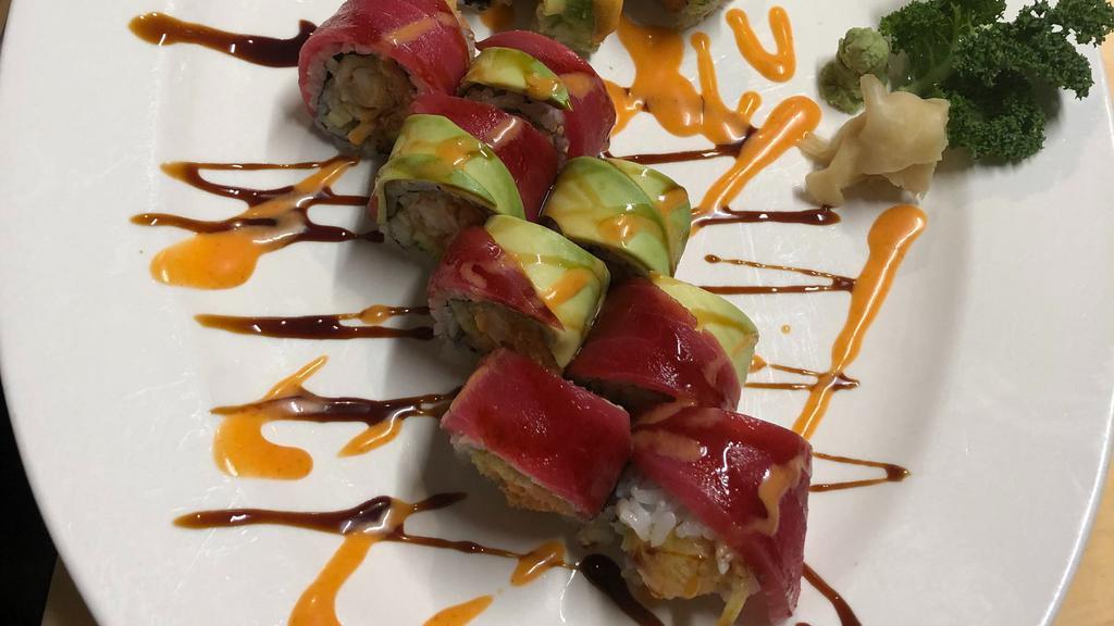 Crazy Dragon · Spicy tuna, shrimp tempura, cucumber roll topped with tuna and avocado. Eel sauce, spicy mayo.