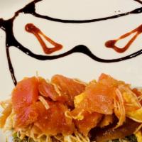 Ninja · Tuna, salmon, red snapper, white tuna (escolar), crabmeat tossed with hot sauce on top of Ca...