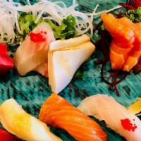 Sushi & Sashimi Dinner · Five pieces sushi, nine pieces sashimi, and California roll.