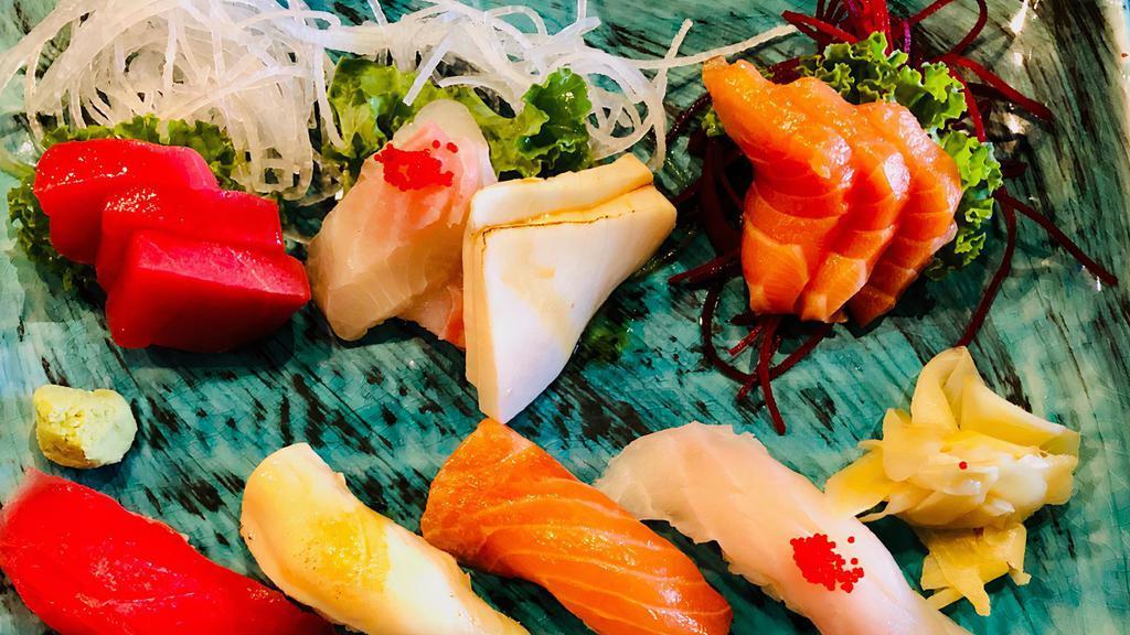 Sushi & Sashimi Dinner · Five pieces sushi, nine pieces sashimi, and California roll.