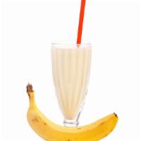Banana Milkshake · Banana milkshake topped with whipped cream.