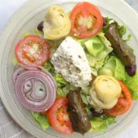 Athenian Greek Salad · Romaine lettuce with feta cheese, artichoke hearts, dolmades, tomatoes, cucumbers and black ...