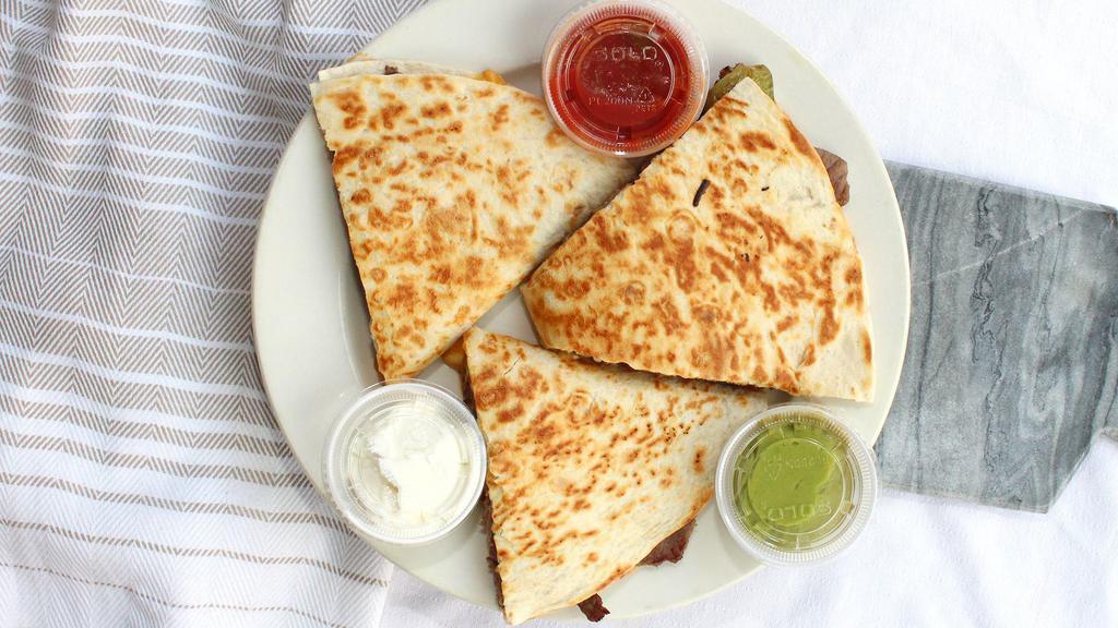 Philly Steak Quesadilla · With sour cream and salsa on the side.