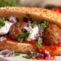 The Meatball Parmigiana Sandwich · Meatball lover's classic! Sizzling meatballs tossed in marinara sauce and melted parmesan ch...