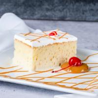 Tres Leche Slice · Our famous Tres Leches cake is a sponge cake soaked in three types of milk, condensed milk, ...
