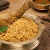 Gongura Kodi (Chicken) Biryani · Spicy basmati rice cooked in biryani spices herbs, correl leaves and juicy chicken leg peices
