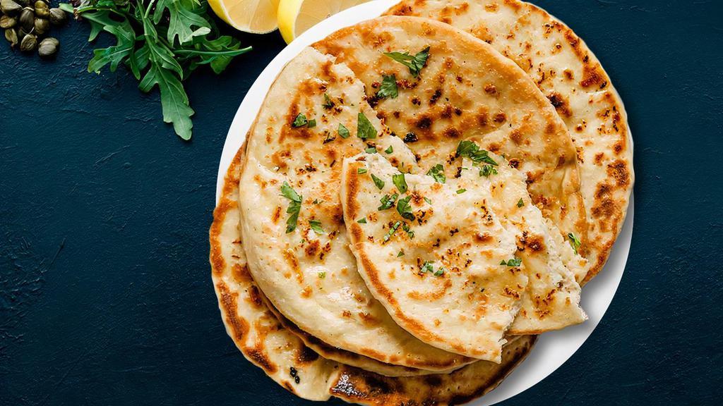 Chilli Naan  · Flatbread made from white flour flavoured with indian spices and baked in tandoor oven