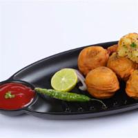 Alu Bonda · Fried potato fritters served with coconut chutney & sambar.