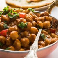 Channa Masala · Chick peas cooked with onions & spices. Served with Basmati rice.