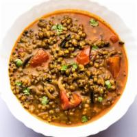 Whole Mung · Gujarati style green lentils cooked with tomatoes, onions & spices. Served with Basmati rice.