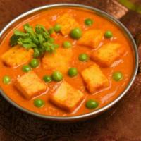 Mutter Paneer · Fresh home made cubed cottage cheese & green peas cooked in cream with mild spices. Served w...