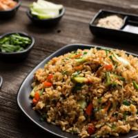 Vegetable Fried Rice · Basmati rice cooked with spring onions, cabbage, carrots, green peas & spices.