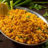 Kashmiri Pulav · Basmati rice cooked with raisins, cashews & vegetables, served with raita.