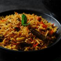 Mixed Vegetable Biryani · Basmati rice cooked with spiced vegetables & served with raita.