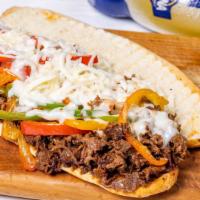 Classic Philly Cheesesteaks  · Shredded steak with sauteed peppers and onions melted cheese on toasted Hero