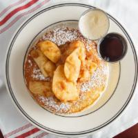 Apple Pie Pancakes · Old fashioned pancakes topped with warm homemade cinnamon baked apples.