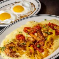 Breakfast Shrimp And Grits · Cajun shrimp and cheesy stone ground grits with tomato, spicy green peppers, herb butter and...