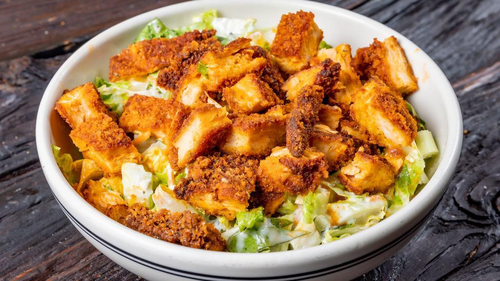 Buffalo Chicken Salad · Hand breaded and crispy fried Buffalo chicken, romaine lettuce, celery, shredded carrots and Gorgonzola crumbles with ranch drizzle.