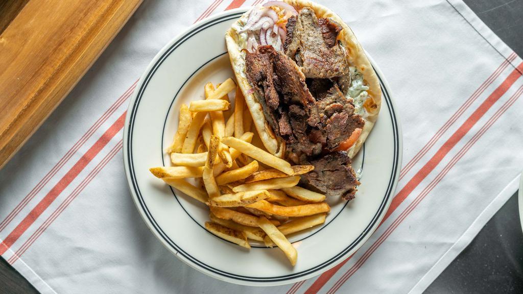 The Gyro Sandwich · Shaved beef and lamb, tomato, cucumber, red onion, Greek tzatziki sauce wrapped in a grilled pita.