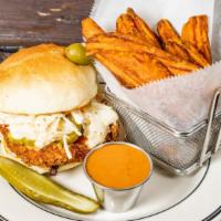 Southern Fried Chicken Sandwich · Southern fried chicken breast, Creole slaw, sliced pickles and chipotle mayo on a rustic rou...