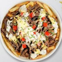 Philly'N It Fries · Steak, caramelized onions, bell peppers, and melted cheese topped on Idaho potato fries.