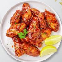 Honey Blaze Wings · Fresh chicken wings breaded, fried until golden brown, and tossed in honey and barbecue sauc...
