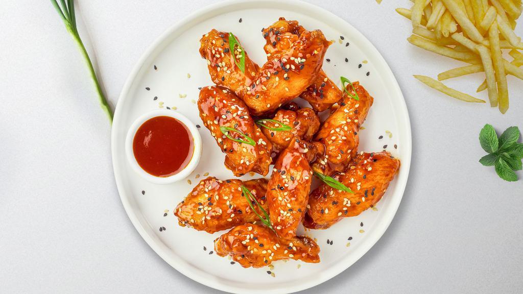 Oriental City Wings · Fresh chicken wings breaded, fried until golden brown, and tossed in sweet and sour sauce. Served with a side of ranch or bleu cheese.