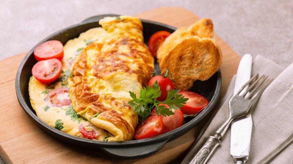 Healthy Omelette Platter · Omelette made with three egg whites, spinach, and mushrooms, with a side of home fries and toast of choice.