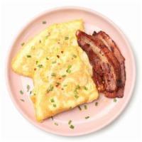 Bacon And Cheese Omelette Platter · Omelette made with bacon and cheese, with a side of home fries and toast of choice.