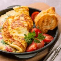 California Omelette Platter · Omelette made with ham, tomatoes, peppers, and cheddar cheese, with a side of home fries and...