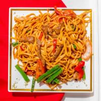 Tallarin Saltado De Pollo · Linguini sautéed with soy sauce, strips of chicken, onions, and tomatoes.