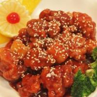 Sesame Chicken · Chunks of chicken deep-fried and sautéed with garlic flavored tangy brown sauce sesame seeds...