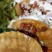 Chorizo Crispy Tacos · Spicy. Spicy homemade Mexican sausage lightly fried. Three crispy corn tortilla stuffed with...