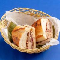 Pan Con Lechon · Roast pork sandwich with onions
