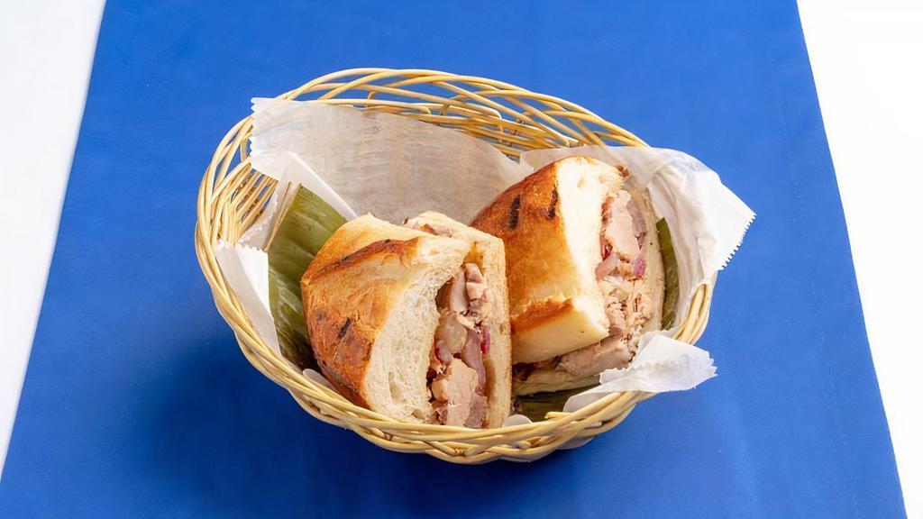 Pan Con Lechon · Roast pork sandwich with onions