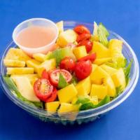 Tropical Salad · Mixed greens with chickpeas, pineapples, mango, tomatoes, and house vinaigrette