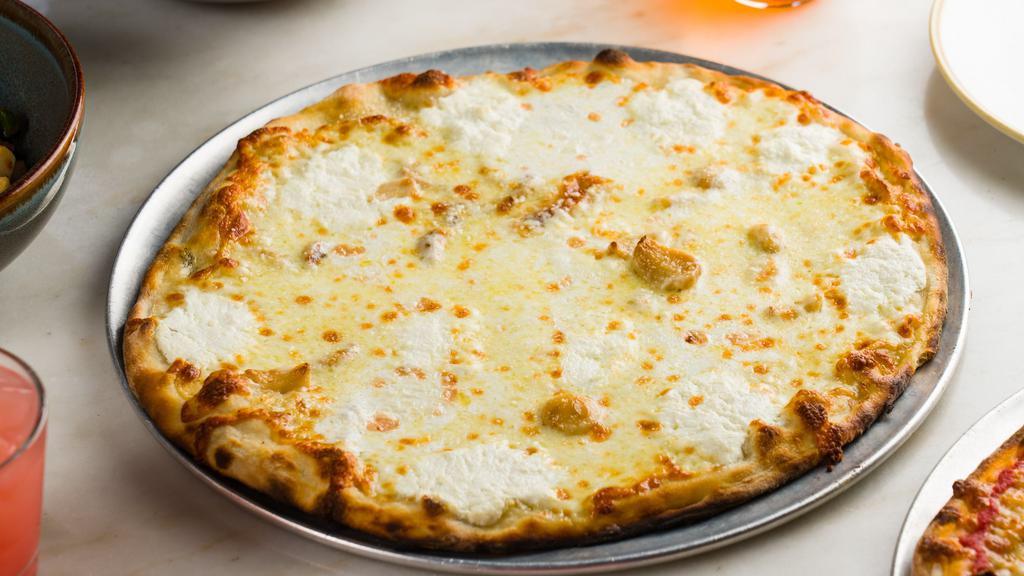 Ricotta Pie · lemon ricotta, mozzarella, Parmigiano-Reggiano, garlic confit, basil oil
