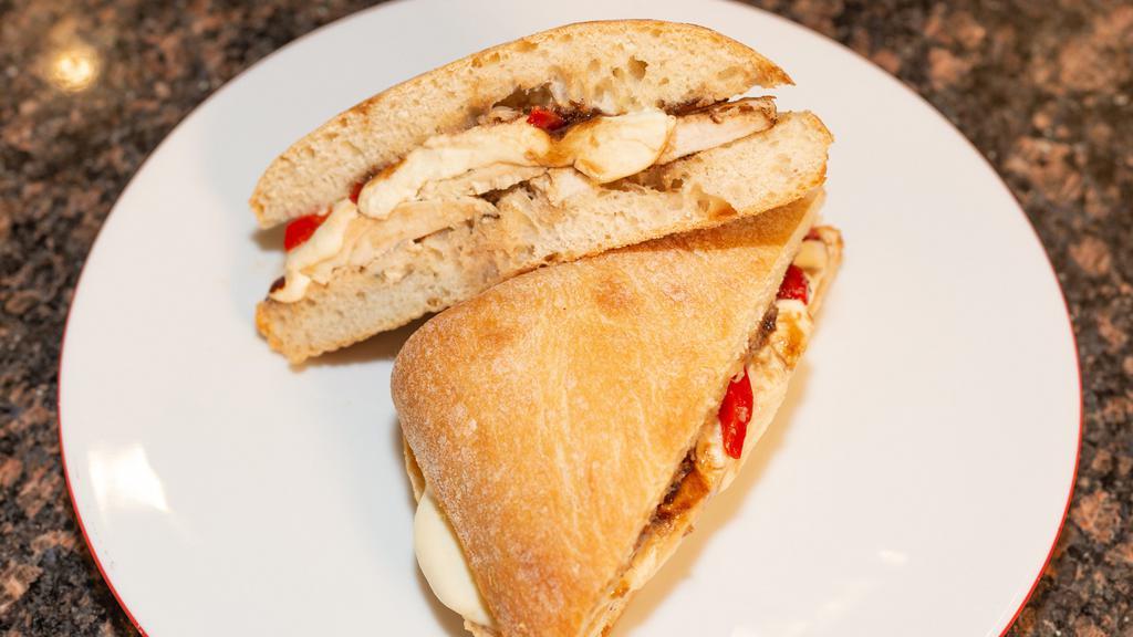 Chicken Panini · Breaded or grilled chicken with fresh mozzarella and roasted red peppers.