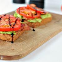 Blt Avocado Toast · Mouthwatering Avocado Toast topped with crispy turkey bacon, lettuce and tomatoes.