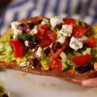 Greek Avocado Toast · Mouthwatering Avocado Toast topped with feta cheese, olives, red onion, sliced cucumber and ...